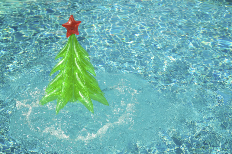 a green and red object in a pool