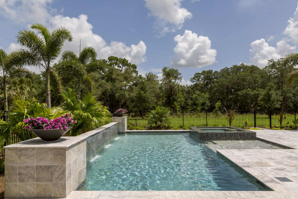 Pool with decorative planter. Rain runoff can lead to cloudy water.