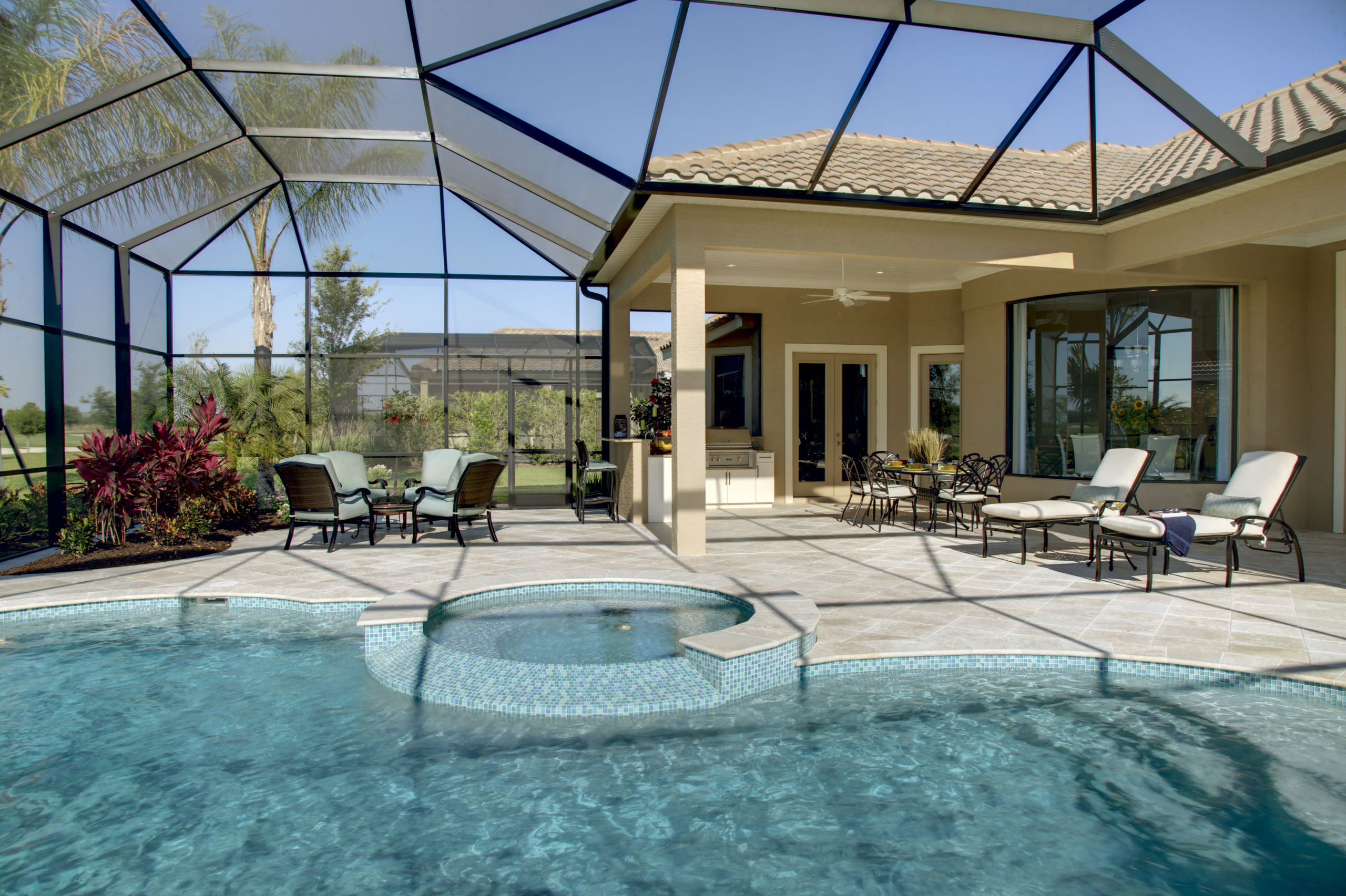 a pool with a hot tub and a patio
